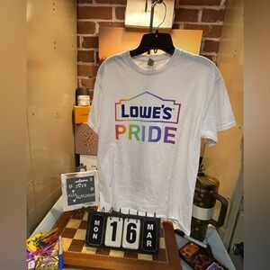 white Lowe's Pride brand t-shirt featuring a rainbow-colored logo.